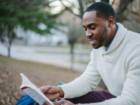 Man sitting outside and reading